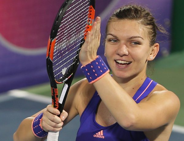 Simona Halep of Romania celebrates after she beat Caroline Wozniacki of Denmark in a semi final match of the Dubai Duty Free Tennis Championships in Dubai, United Arab Emirates, Friday, Feb. 20, 2015. (AP Photo/Kamran Jebreili)