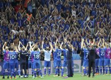 Iceland players celebrate with their supporters at the end of the Euro 2016 round of 16 soccer match between England and Iceland, at the Allianz Riviera stadium in Nice, France, Monday, June 27, 2016. (AP Photo/Claude Paris)