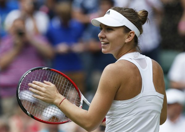 epa04295552 Simona Halep of Romania after defeating Sabine Lisicki of Germany in their quarter final match at the Wimbledon Championships at the All England Lawn Tennis Club, in London, Britain, 02 July 2014.  EPA/VALDRIN XHEMAJ