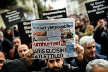 Members of journalism unions shout slogans and hold placards "reading: Freedom for journalist" on November 29, 2015 in Istanbul, during a demonstration after the arrest of their Editor in Chief. A court in Istanbul charged two journalists from the opposition Cumhuriyet newspaper with spying after they alleged Turkey's secret services had sent arms to Islamist rebels in Syria, Turkish media reported. Editor-in-chief Can Dundar and Erdem Gul, the paper's Ankara bureau chief, are accused of spying and "divulging state secrets". Both men were placed in pre-trial detention. AFP PHOTO/OZAN KOSE / AFP / OZAN KOSE        (Photo credit should read OZAN KOSE/AFP/Getty Images)