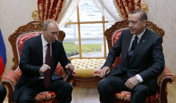 Russia's President Vladimir Putin (L) speaks with Turkey's Prime Minister Recep Tayyip Erdogan in Istanbul on December 3, 2012. Putin arrived in Istanbul on December 3 for a landmark visit due to focus on resolving differences with Turkey over the 20-month crisis in war-ravaged Syria. AFP PHOTO / POOL / TOLGA BOZOGLU        (Photo credit should read TOLGA BOZOGLU/AFP/Getty Images)