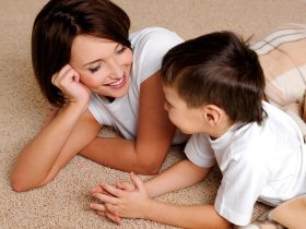 Smiling young mother has a good time in conversations with the son of preschool age