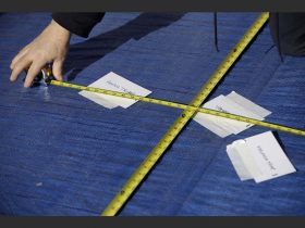 A worker measures President-elect Donald Trump's onstage standing position for his swearing-in ceremony, following an inauguration rehearsal at the U.S. Capitol, Sunday, Jan. 15, 2017, in Washington. (AP Photo/Patrick Semansky)/DCPS104/17015692113486/1701152028