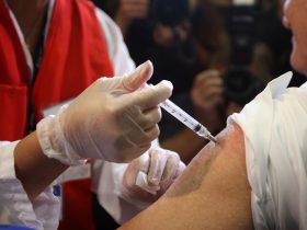 ENCINO, CA - OCTOBER 23: Director of the Department of Public Health Public Health and Health Officer for Los Angeles County, Dr. Jonathan E. Fielding, receives an H1N1 vaccination during the launch of the first Public Health H1N1 vaccine clinics in Los Angeles County on October 23, 2009 in the Los Angeles area community of Encino, California. The clinics will provide free vaccine against H1N1, also known as swine flu, to priority groups and people who do not have health insurance or a regular source of health care.   David McNew/Getty Images/AFP