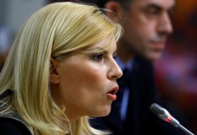 FILE PHOTO: Romania's Tourism Minister Elena Udrea speaks in front of a parliamentary commission at Romania's Parliament palace in Bucharest, Romania, August 20, 2009.  REUTERS/Bogdan Cristel/File Photo