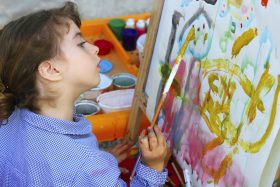 artist school little girl painting brush watercolors portrait