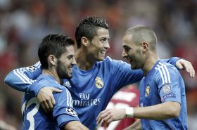 Real Madrid's Cristiano Ronaldo (C) celebrates a goal with team mates Isco (L) and Karim Benzema against Galatasaray during their Champions League Group B soccer match at Turk Telekom Arena in Istanbul September 17, 2013.     REUTERS/Osman Orsal (TURKEY  - Tags: SPORT SOCCER)