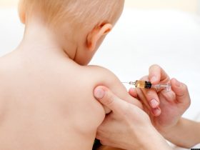 Doctor giving a child an intramuscular injection in arm, shallow DOF; Shutterstock ID 39307024; PO: test; Job: dev; Client: drone
