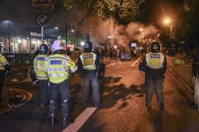 LONDON, UNITED KINGDOM - JUNE 26: Police intervene in as demonstrators erect barricades and set fires to roads near the Forest Gate police station in London, England, United Kingdom on June 26, 2017 during a demonstration protesting the death of a 25-year-old black male Edir Frederico Da Costa (Edson). The disturbance followed a Black Lives Matter protest after the death of Edir Frederico Da Costa (Edson) six days after he was arrested by police. Protesters demanded answers to questions surrounding Da Costa’s death and threw bricks at police while chanting “Justice for Edson!” Da Costa was in a car with two other people when it was stopped by police in the Newham area in East London. Behlul Cetinkaya / Anadolu Agency