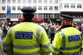 LONDON, ENGLAND - JUNE 20:  Police watch an Anti Austerity demonstration at Bank Of England on June 20, 2015 in London, England.  Thousands of people gathered to march from the City of London to Westminster, where they listened to addresses from singer Charlotte Church and comedian Russell Brand as well as Len McCluskey, general secretary of Unite and Sinn Fein's Martin McGuinness.  (Photo by Zak Kaczmarek/Getty Images)