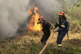 ATHENS, GREECE - AUGUST 15 : Firefighters battle with a wildfire which has been continuing for three days, in Kalamos region of Athens, Greece on August 15, 2017. High winds are driving wildfires near the Greek capital Athens, forcing residents and holidaymakers to flee. More than 20 houses have already been damaged as the blazes, which began on Sunday, burned through pine forests north of the city. Around 150 firefighters, with the help of helicopters and planes, are still battling to contain fires in the coastal areas of Kalamos and Varnava. Ayhan Mehmet / Anadolu Agency