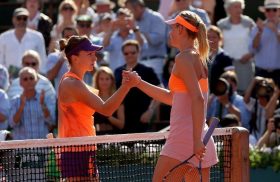 PARIS, FRANCE - JUNE 07: Simona Halep of Romania shakes hands with Maria Sharapova of Russia after their women's singles final match on day fourteen of the French Open at Roland Garros on June 7, 2014 in Paris, France. (Photo by Matthew Stockman/Getty Images)