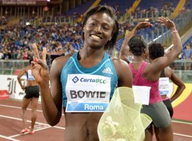 US athlete Tori Bowie celebrates after winning the women's 100m event during the IAAF Diamond League Golden Gala at Rome's Olympic Stadium on June 5, 2014.   AFP PHOTO / TIZIANA FABI        (Photo credit should read TIZIANA FABI/AFP/Getty Images)