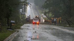 Crews work to remove fallen trees and power lines from the roadway and homes along Highway 18 in Fayette, Ala., after a tornado went through Fayette County on Thursday, Aug. 31, 2017. (Erin Nelson /The Tuscaloosa News via AP)